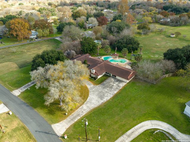a view of a yard with a swimming pool