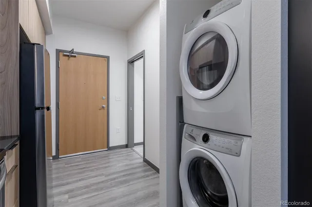 a view of a hallway with washer and dryer