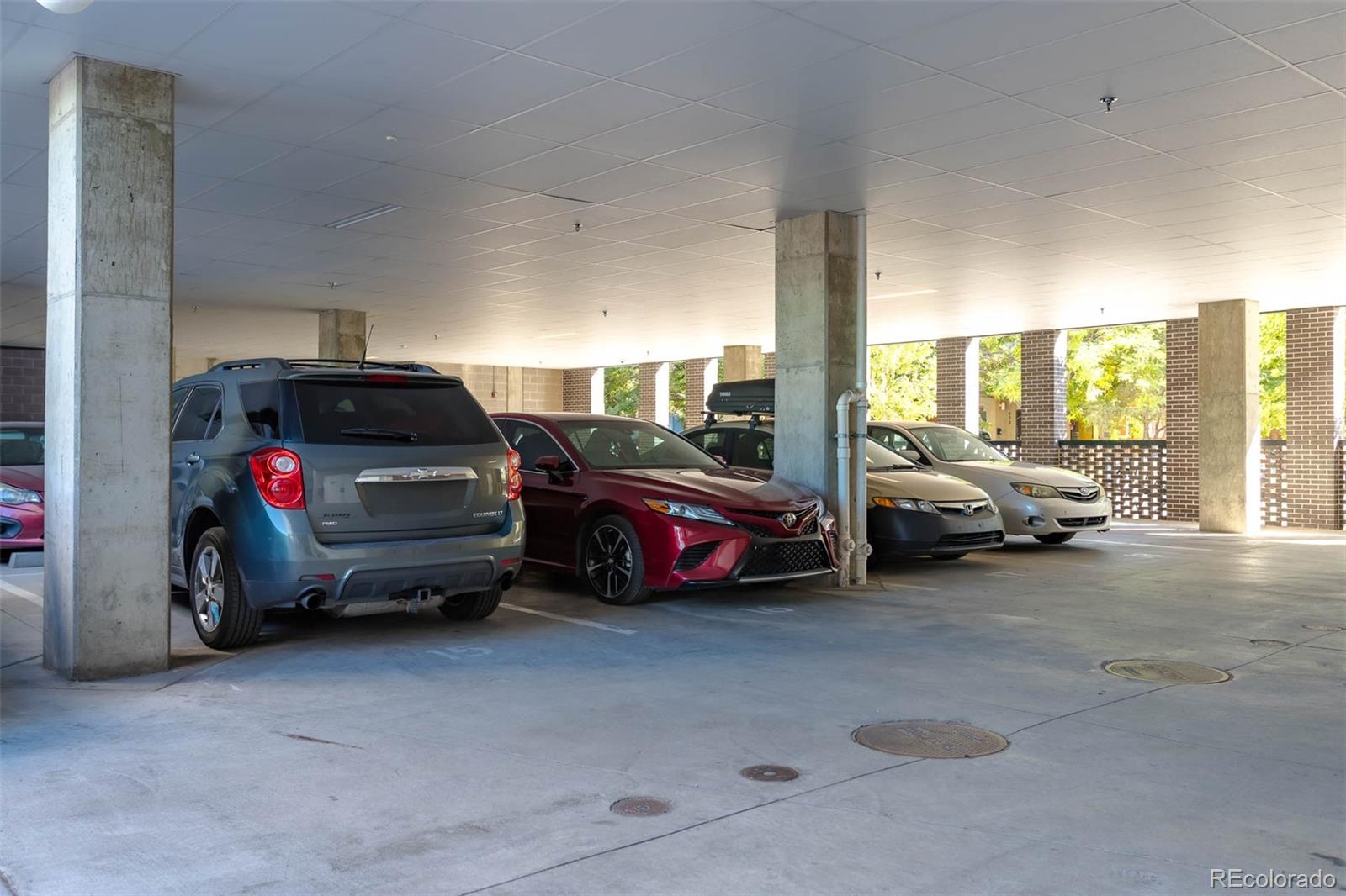 603 Inca Street, Unit 216 Denver, CO 80204 - Photo 21 of 22 a view of cars parked in a parking lot