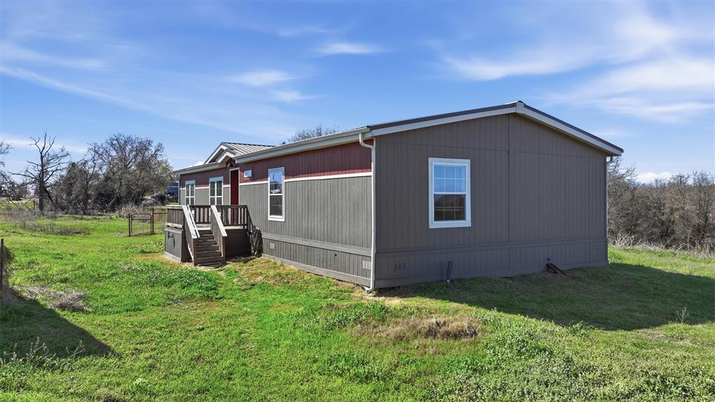 151 Private Road 3814 Springtown, TX 76082 - Photo 28 of 29 a backyard of a house with lots of green space