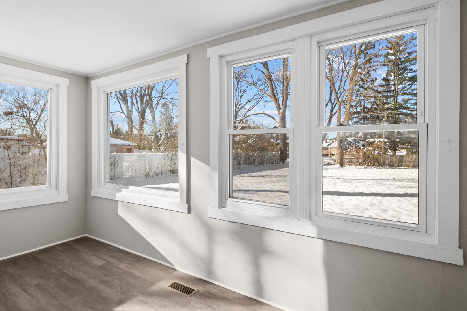 5604 South Madison Avenue Countryside, IL 60525 - Photo 12 of 29 a view of an empty room with wooden floor and a window