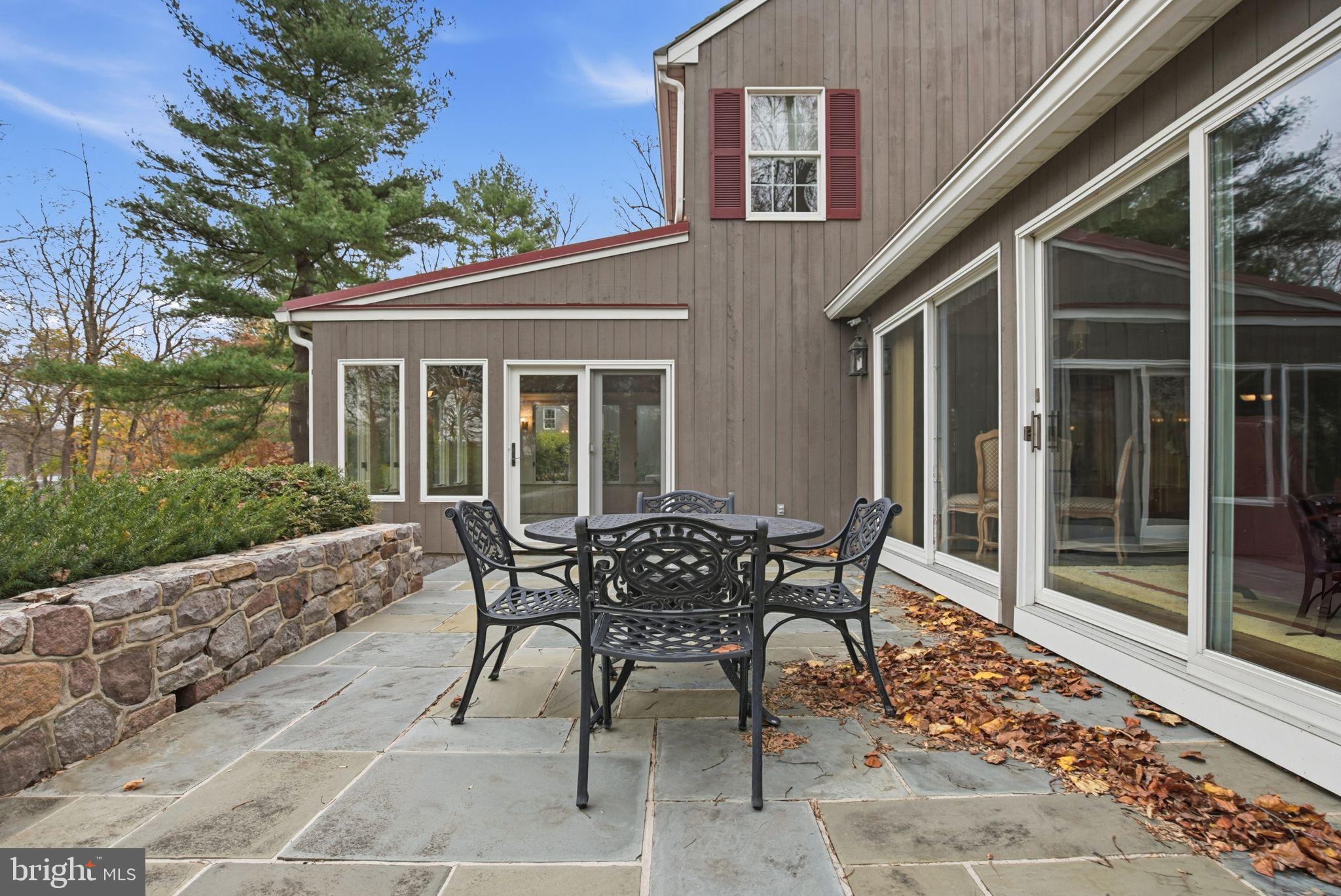 14 Devon Drive New Hope, PA 18938 - Photo 13 of 40 a patio with table and chairs and potted plants