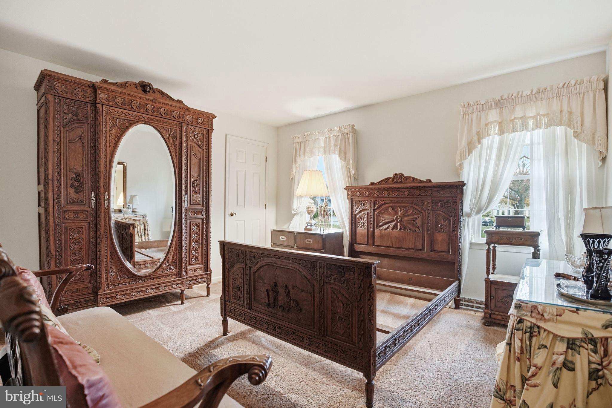 14 Devon Drive New Hope, PA 18938 - Photo 23 of 40 a living room with furniture a fireplace and a large window