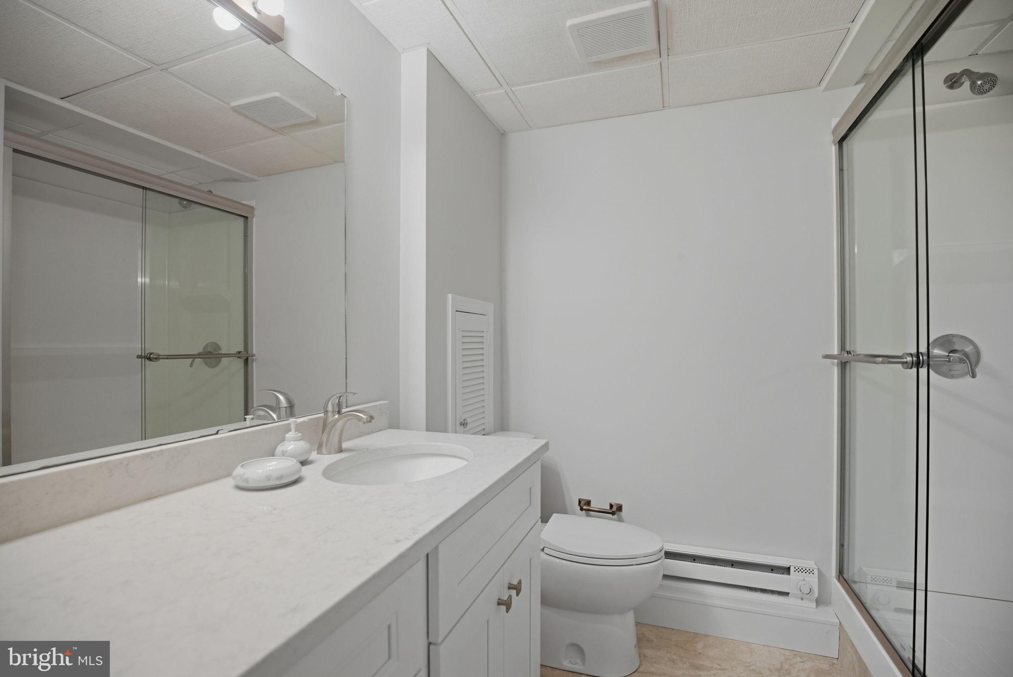 14 Devon Drive New Hope, PA 18938 - Photo 28 of 40 a bathroom with a sink toilet and shower