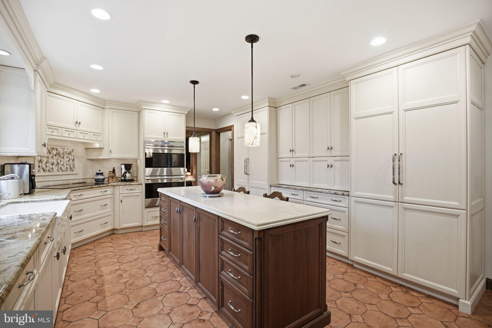 14 Devon Drive New Hope, PA 18938 - Photo 4 of 40 a kitchen with a sink refrigerator and cabinets