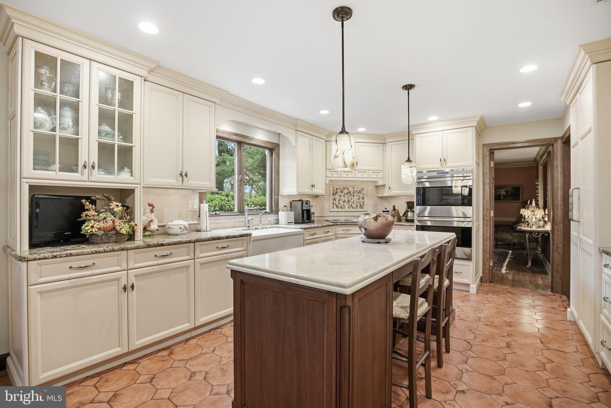 14 Devon Drive New Hope, PA 18938 - Photo 6 of 40 a kitchen with stainless steel appliances granite countertop a stove a sink a refrigerator a center island and a cabinets