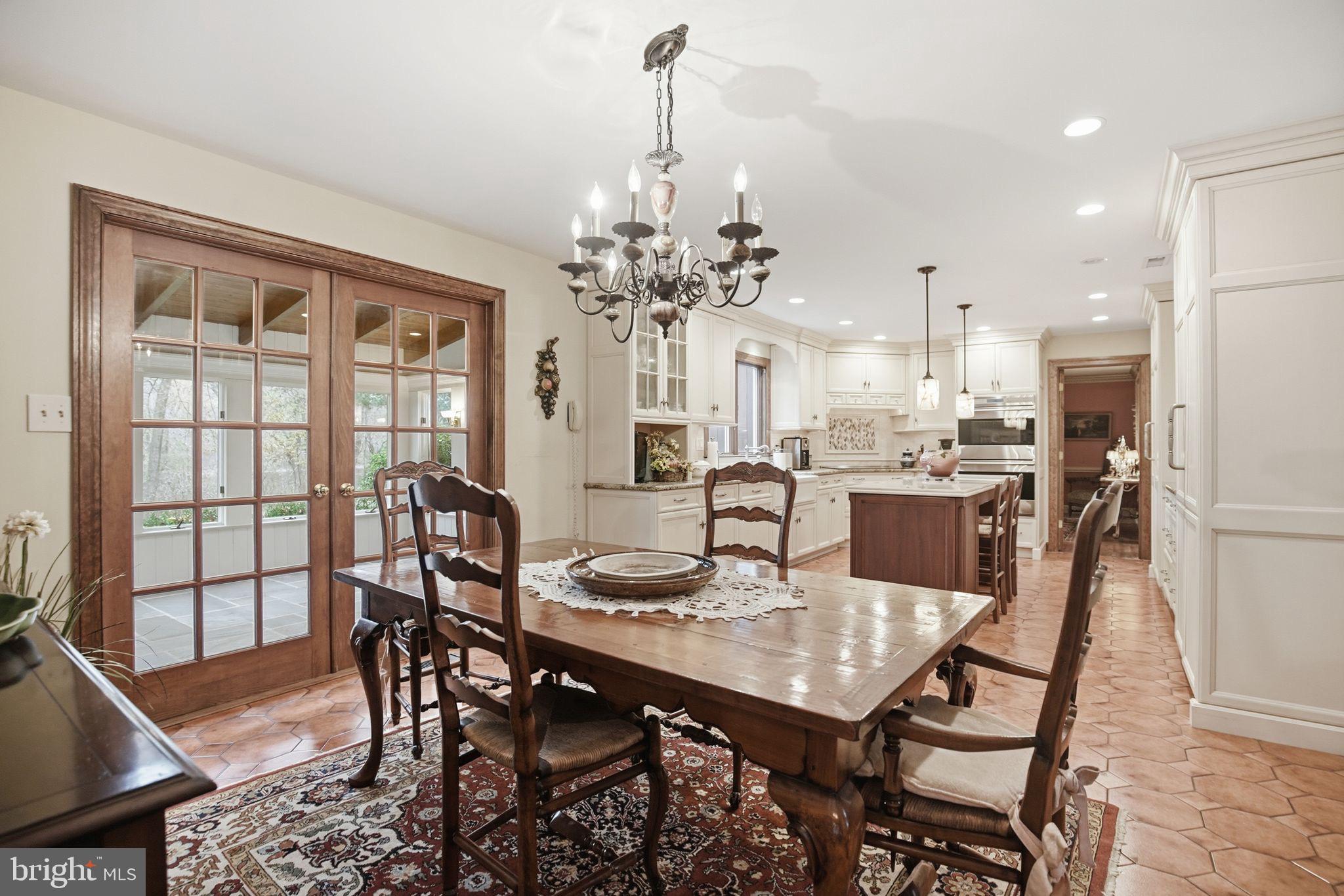 14 Devon Drive New Hope, PA 18938 - Photo 8 of 40 a dining room with furniture a chandelier and wooden floor