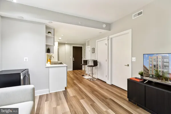 a living room with furniture and a window