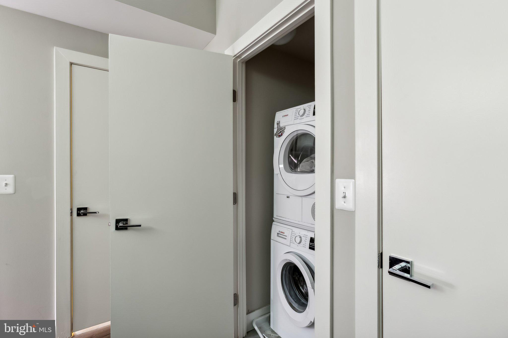 1311 13th Street Northwest, Unit T04 Washington, DC 20005 - Photo 16 of 18 a utility room with dryer and washer