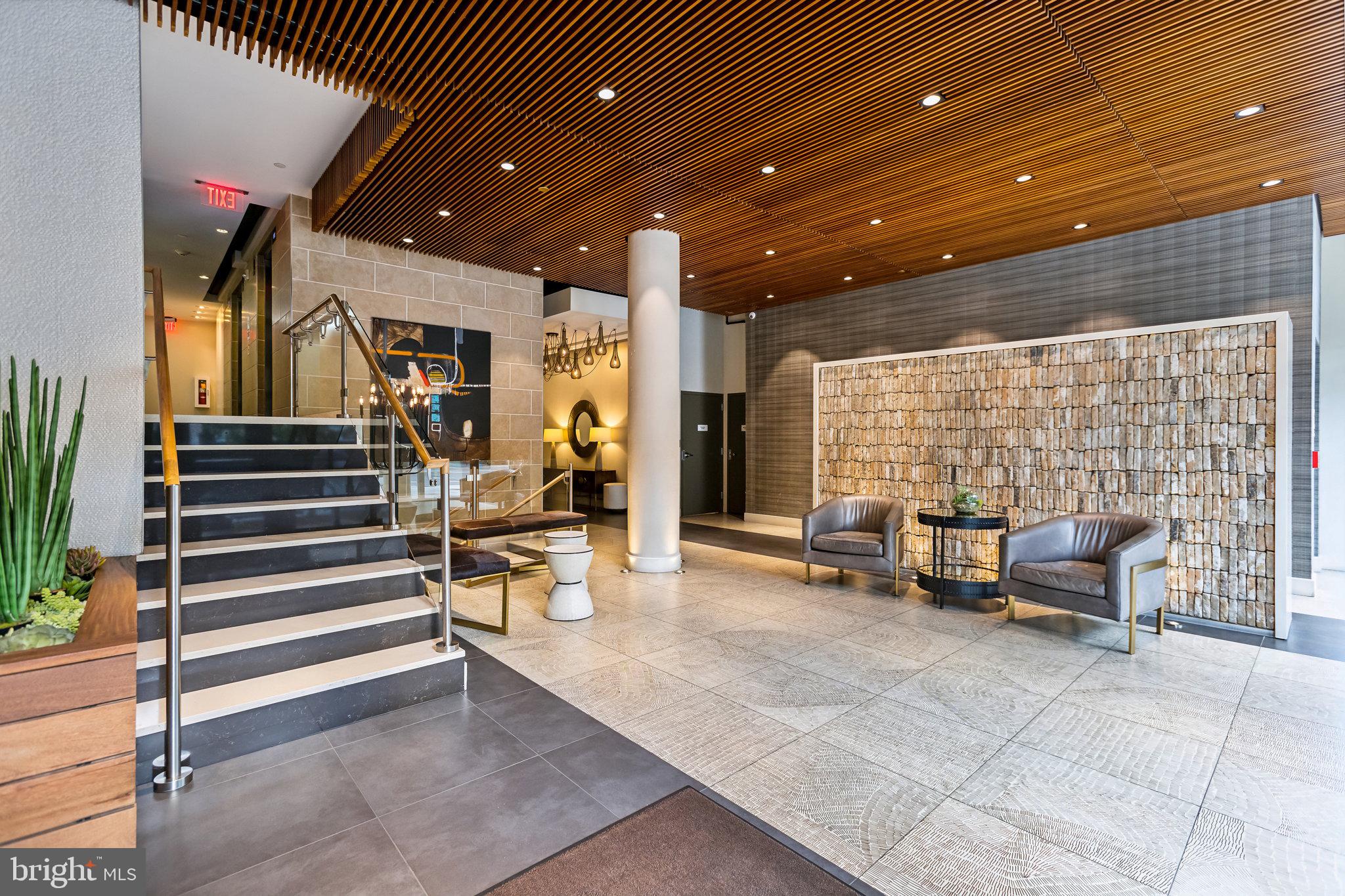 1311 13th Street Northwest, Unit T04 Washington, DC 20005 - Photo 2 of 18 a view of a building with couch and chairs