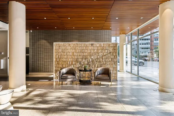 a view of a patio with table and chairs