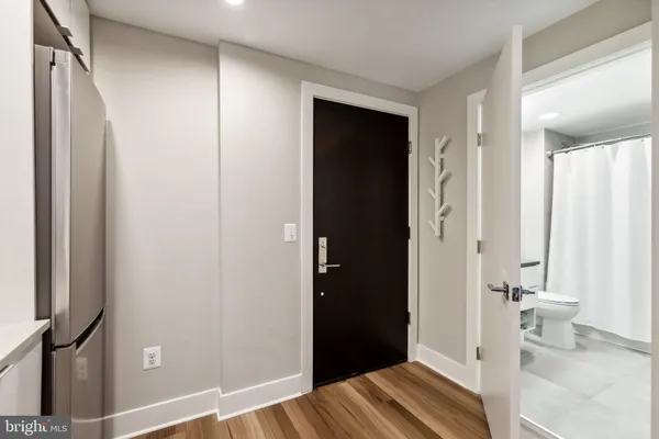 a view of bedroom with wooden floor