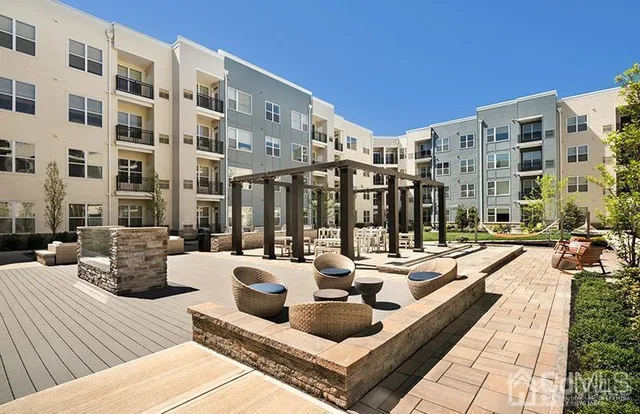 a view of a building with sitting area