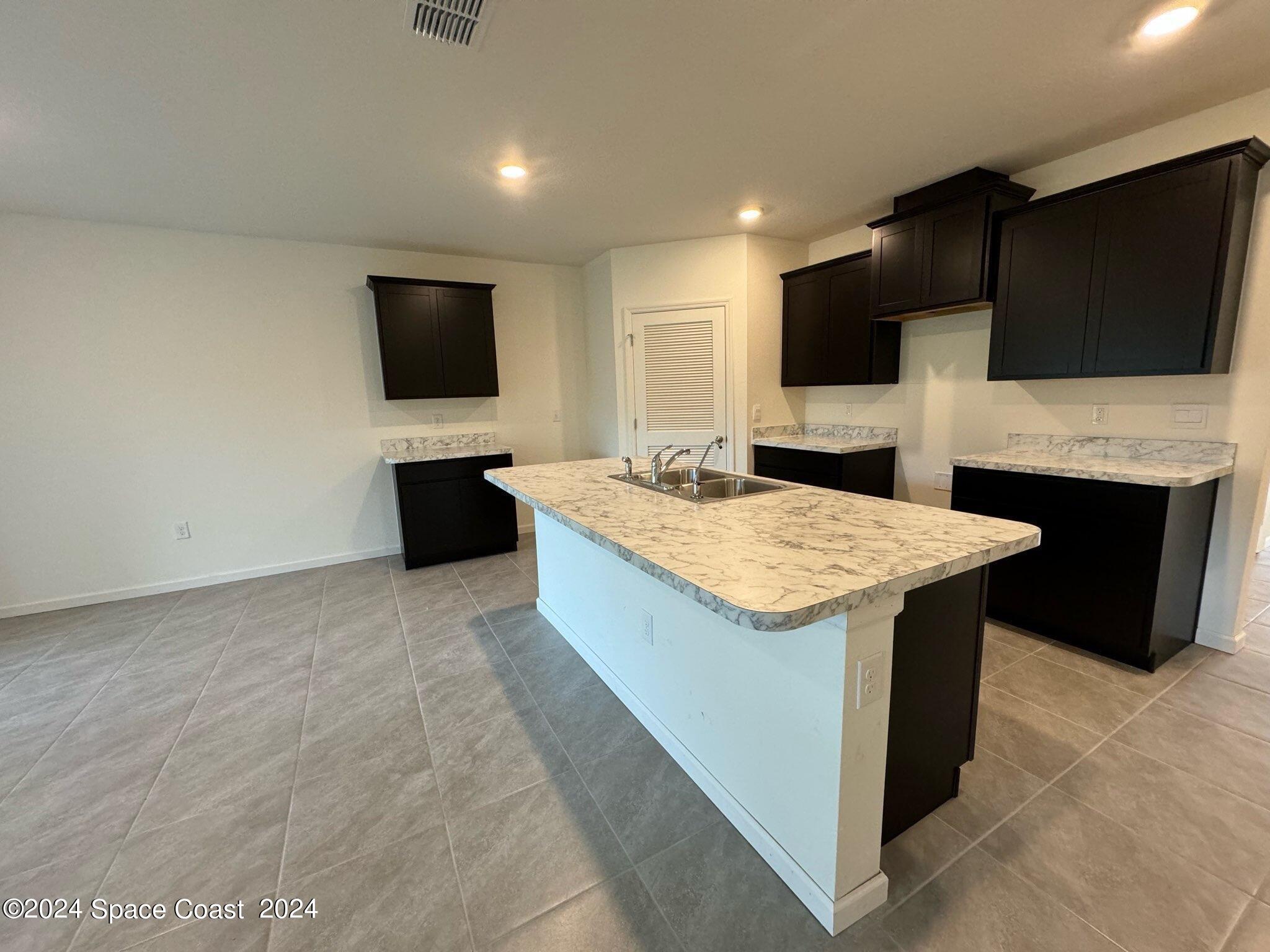 435 Oakleaf Street Southwest Palm Bay, FL 32908 - Photo 4 of 44 10. 435 Oakleaf - Kitchen.2