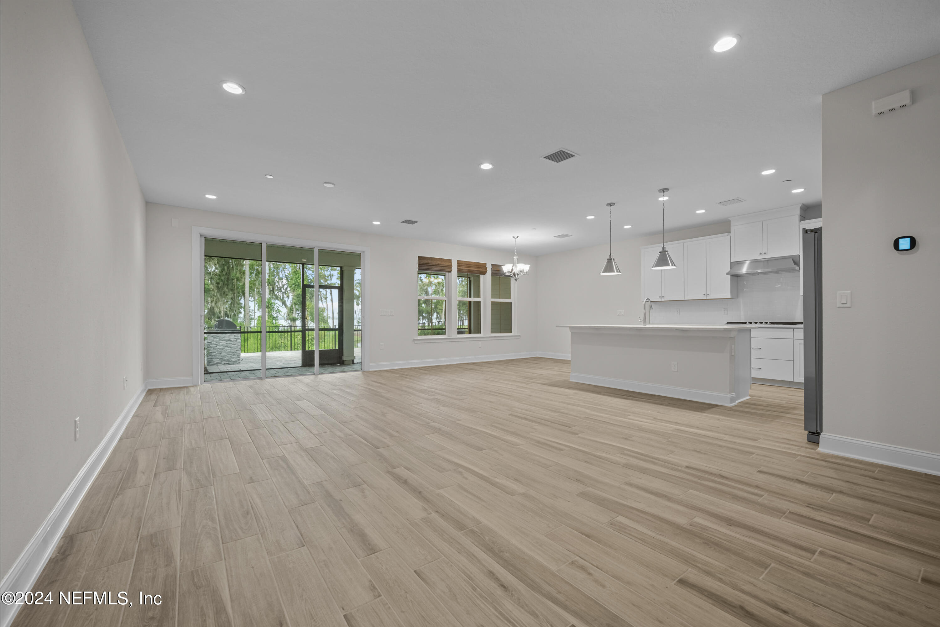 23 Oak Pk Drive St. Johns, FL 32259 - Photo 12 of 72 a view of an empty room with wooden floor and a window