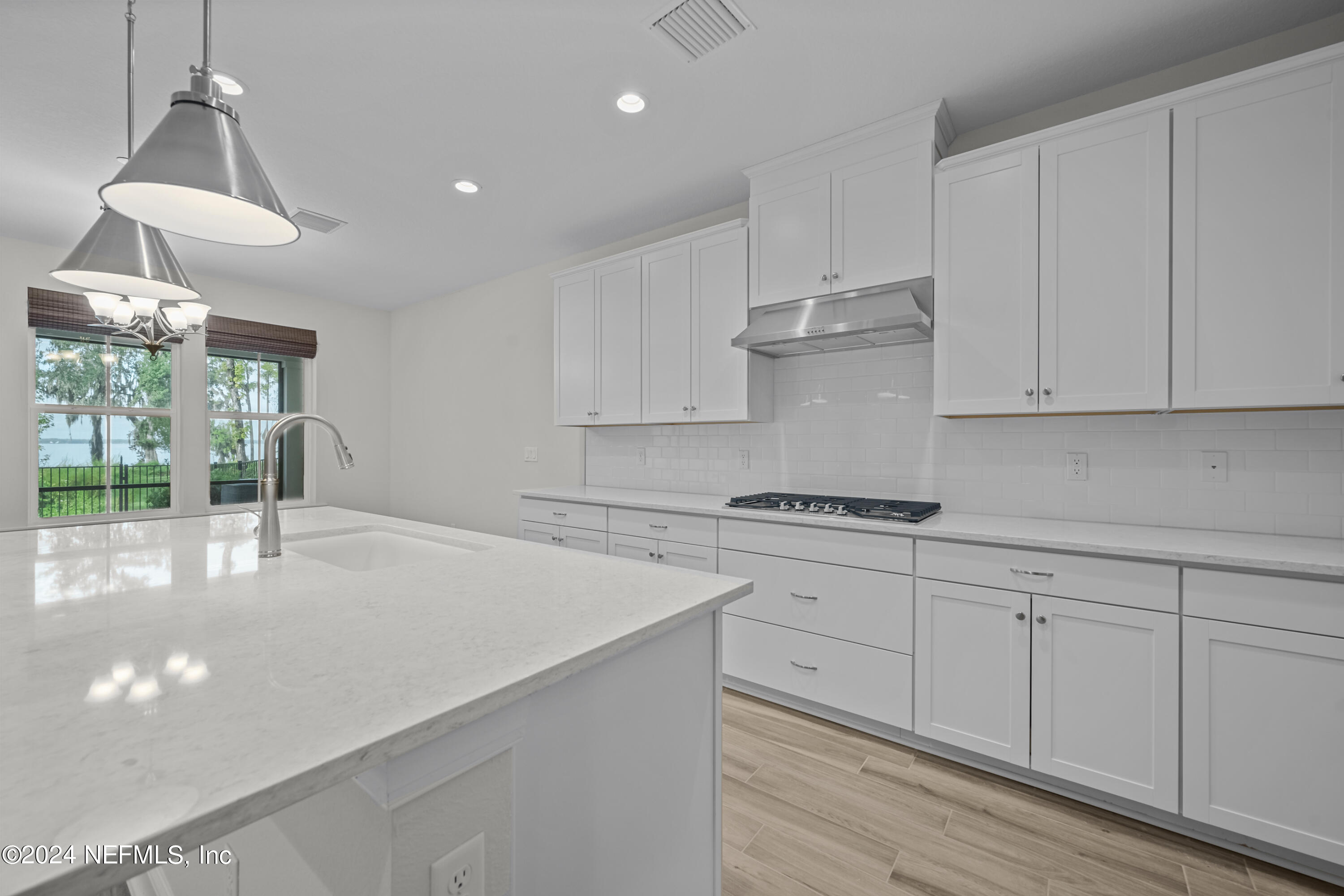 23 Oak Pk Drive St. Johns, FL 32259 - Photo 16 of 72 a kitchen with granite countertop white cabinets and white appliances