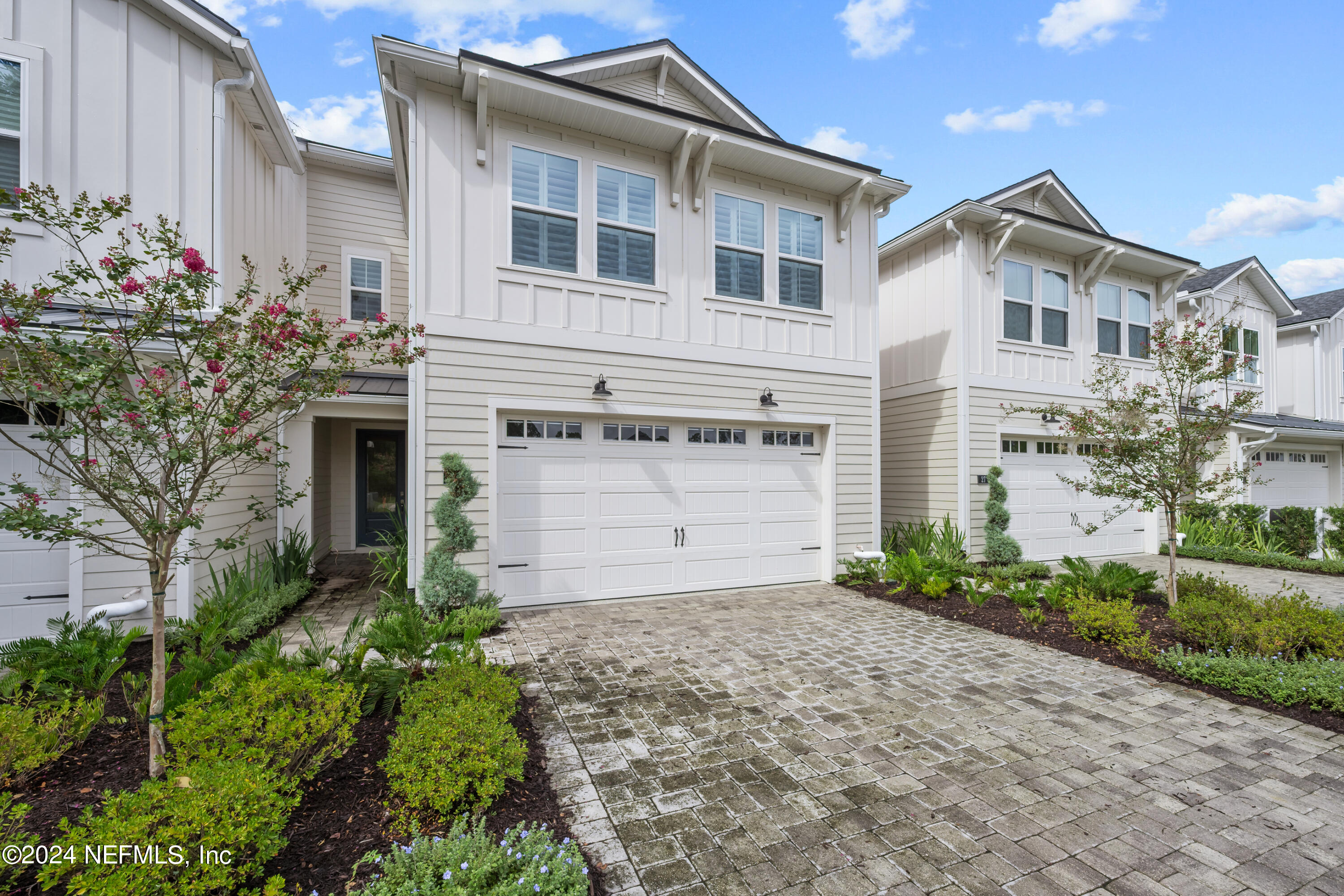 23 Oak Pk Drive St. Johns, FL 32259 - Photo 3 of 72 a front view of a house with a yard and garage
