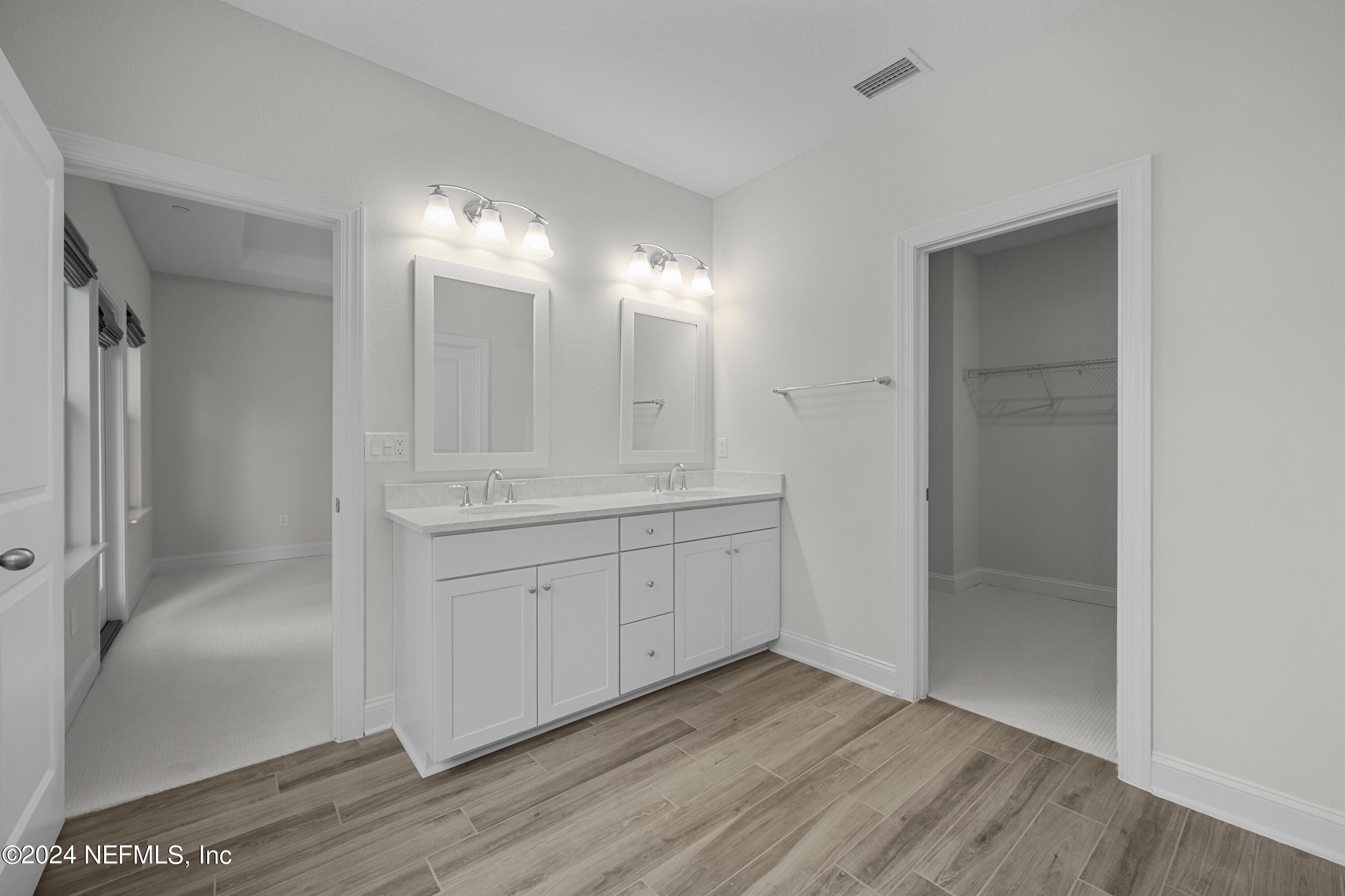 23 Oak Pk Drive St. Johns, FL 32259 - Photo 33 of 72 a bathroom with a sink and a mirror