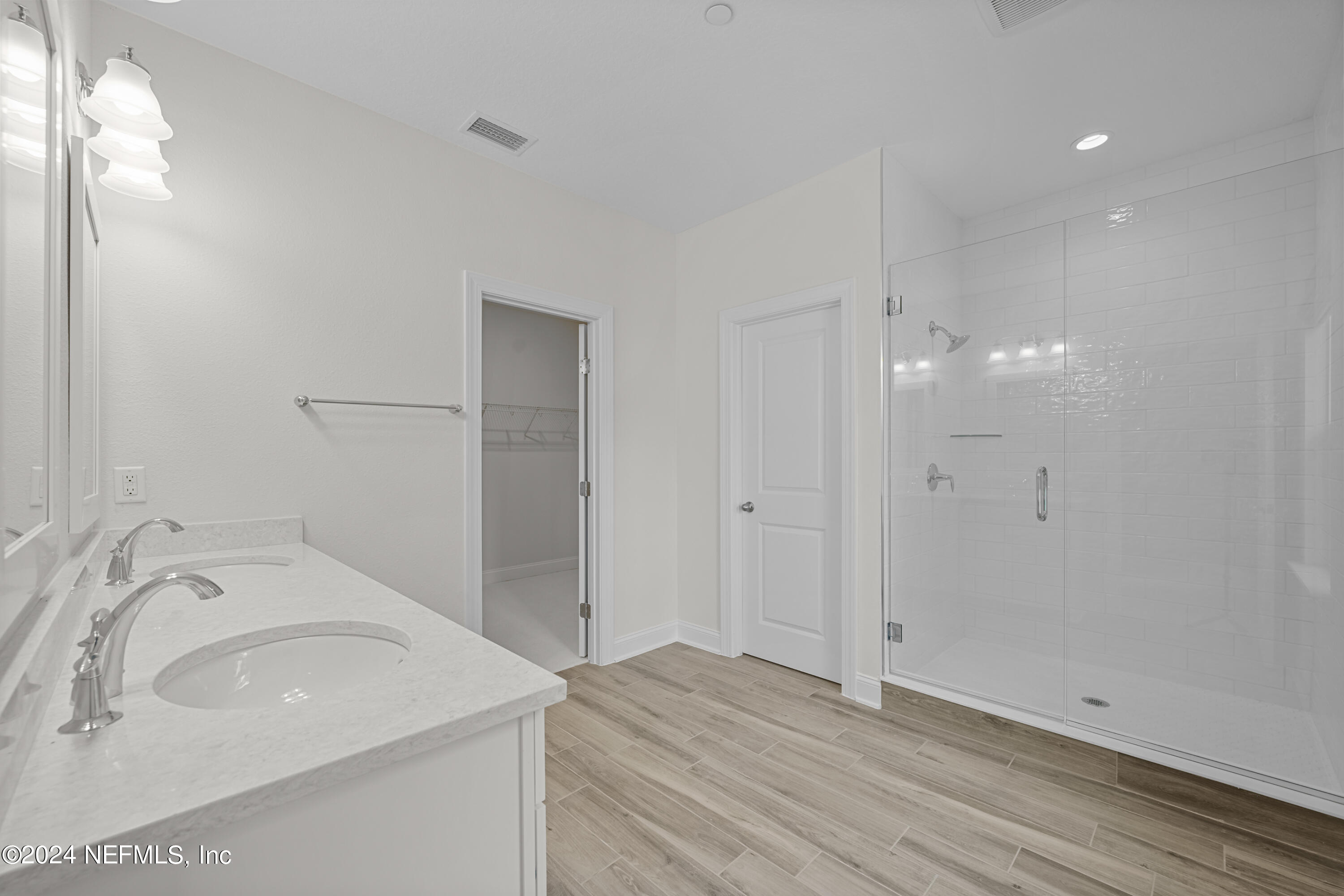 23 Oak Pk Drive St. Johns, FL 32259 - Photo 35 of 72 a bathroom with a sink and a large mirror