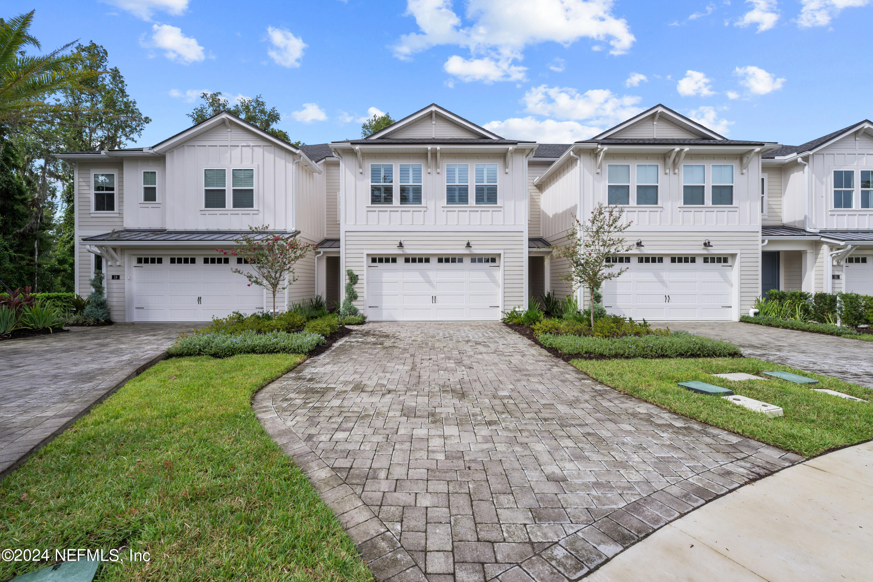 23 Oak Pk Drive St. Johns, FL 32259 - Photo 52 of 72 a front view of a house with a yard and garage