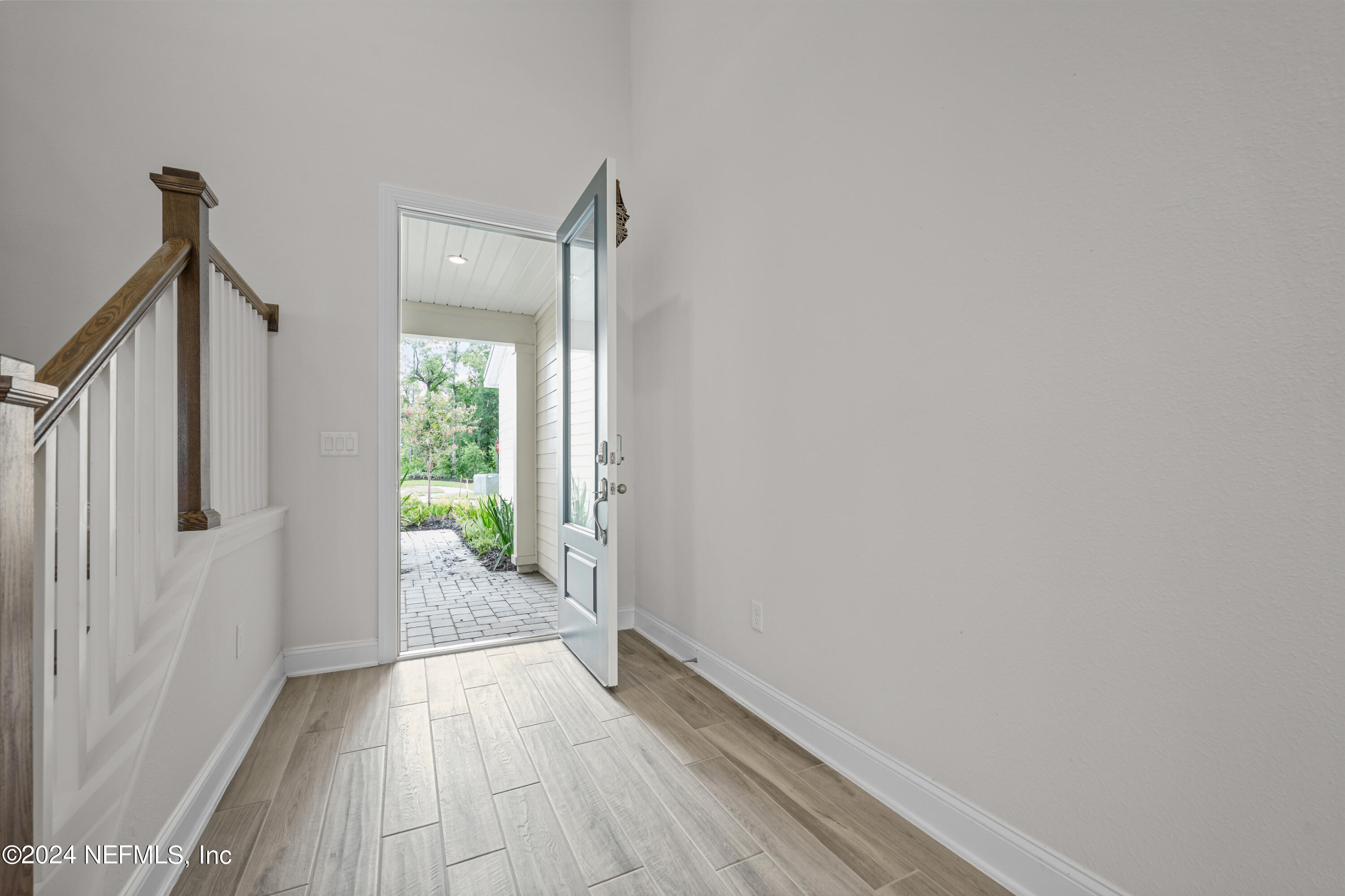 23 Oak Pk Drive St. Johns, FL 32259 - Photo 6 of 72 a view of a hallway with wooden floor and a bathroom