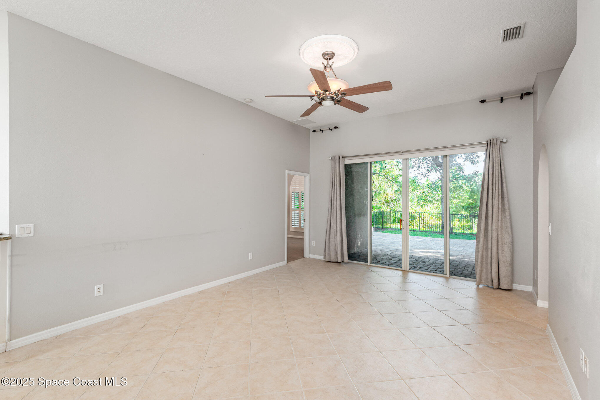 1247 Hasley Place Melbourne, FL 32940 - Photo 12 of 33 a view of an empty room with a window