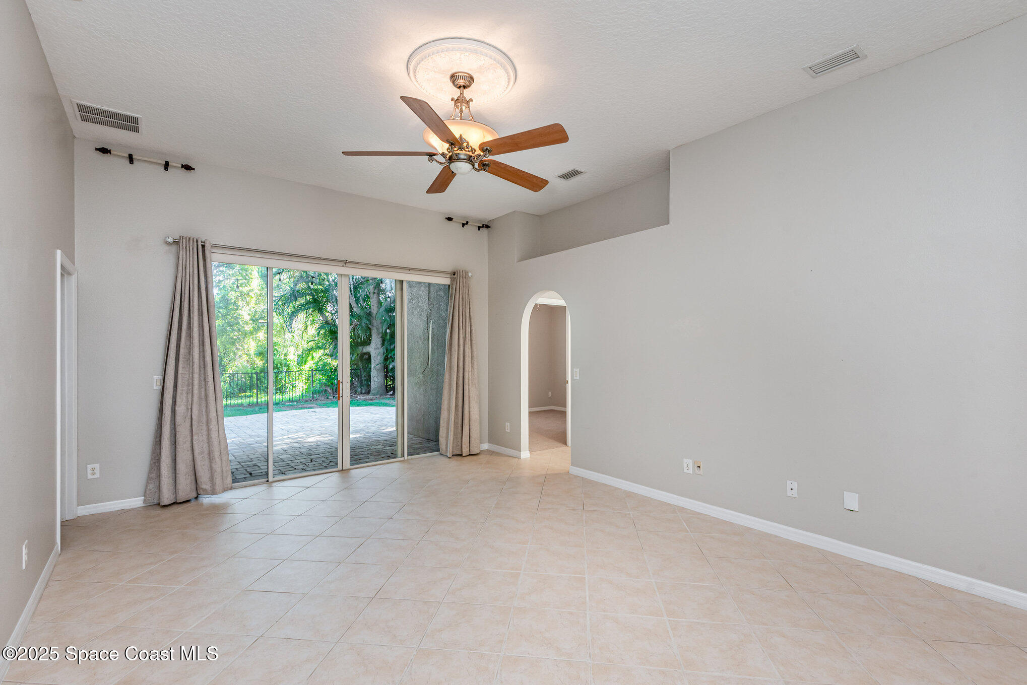 1247 Hasley Place Melbourne, FL 32940 - Photo 13 of 33 a view of an empty room with a window