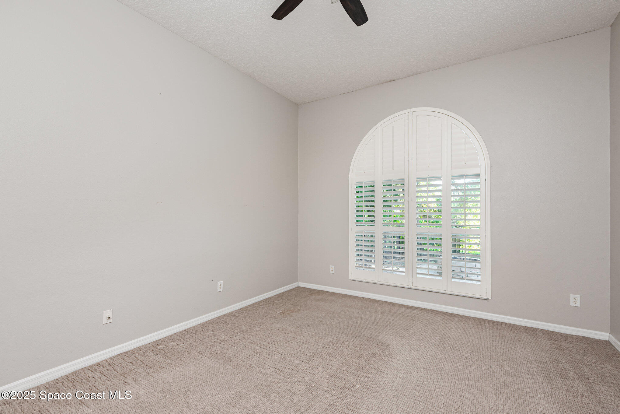 1247 Hasley Place Melbourne, FL 32940 - Photo 15 of 33 an empty room with a empty space and a window