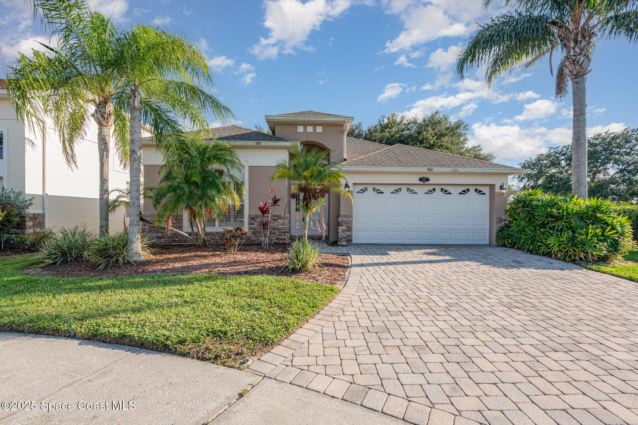 1247 Hasley Place Melbourne, FL 32940 - Photo 2 of 33 a front view of a house with garden