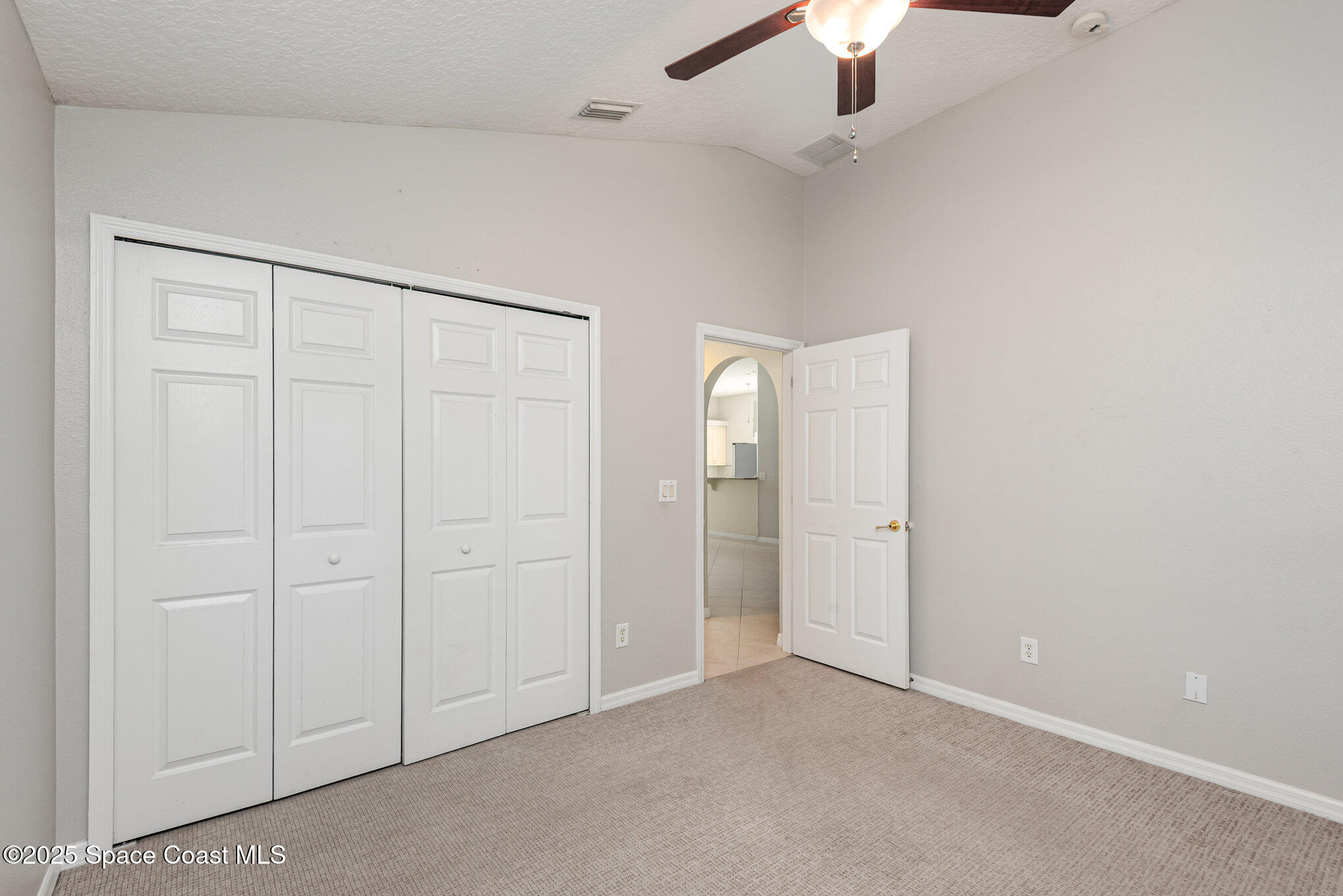 1247 Hasley Place Melbourne, FL 32940 - Photo 21 of 33 an empty room with chandelier fan
