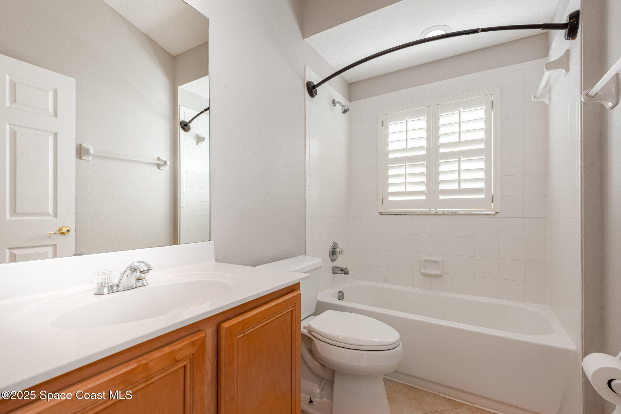 1247 Hasley Place Melbourne, FL 32940 - Photo 22 of 33 a bathroom with a sink a toilet and a bathtub