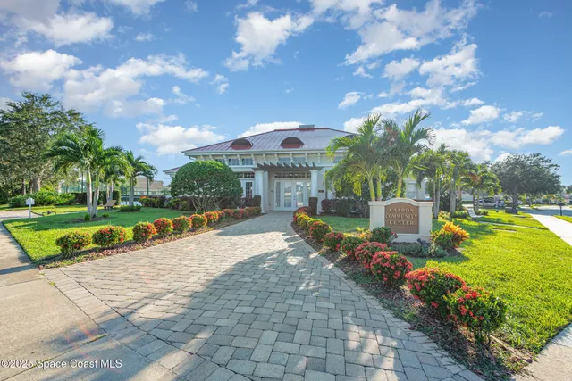 a house view with a sitting space garden and patio