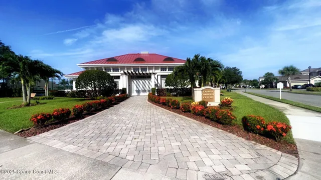 a view of a house with swimming pool yard fire pit and slide