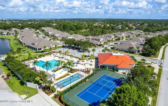 an aerial view of a house with a garden