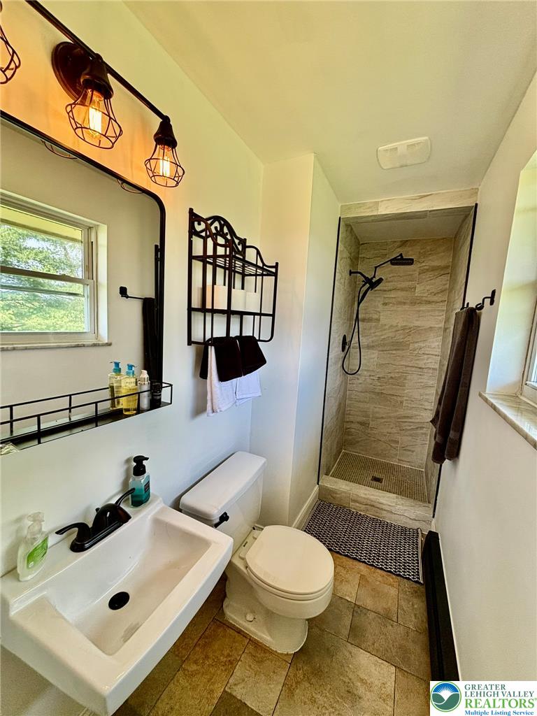 8813 Bluejay Road Kempton, PA 19529 - Photo 15 of 23 This functional bathroom provides a comfortable and convenient space for daily routines.