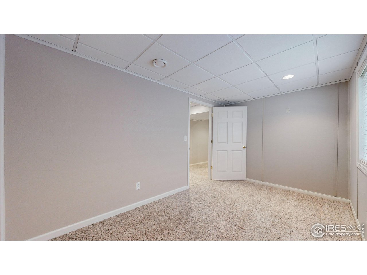 3585 West 20th Street Road Greeley, CO 80634 - Photo 22 of 32 a open hall with a bench