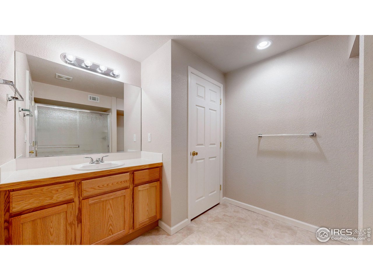 3585 West 20th Street Road Greeley, CO 80634 - Photo 25 of 32 a bathroom with a sink and a mirror