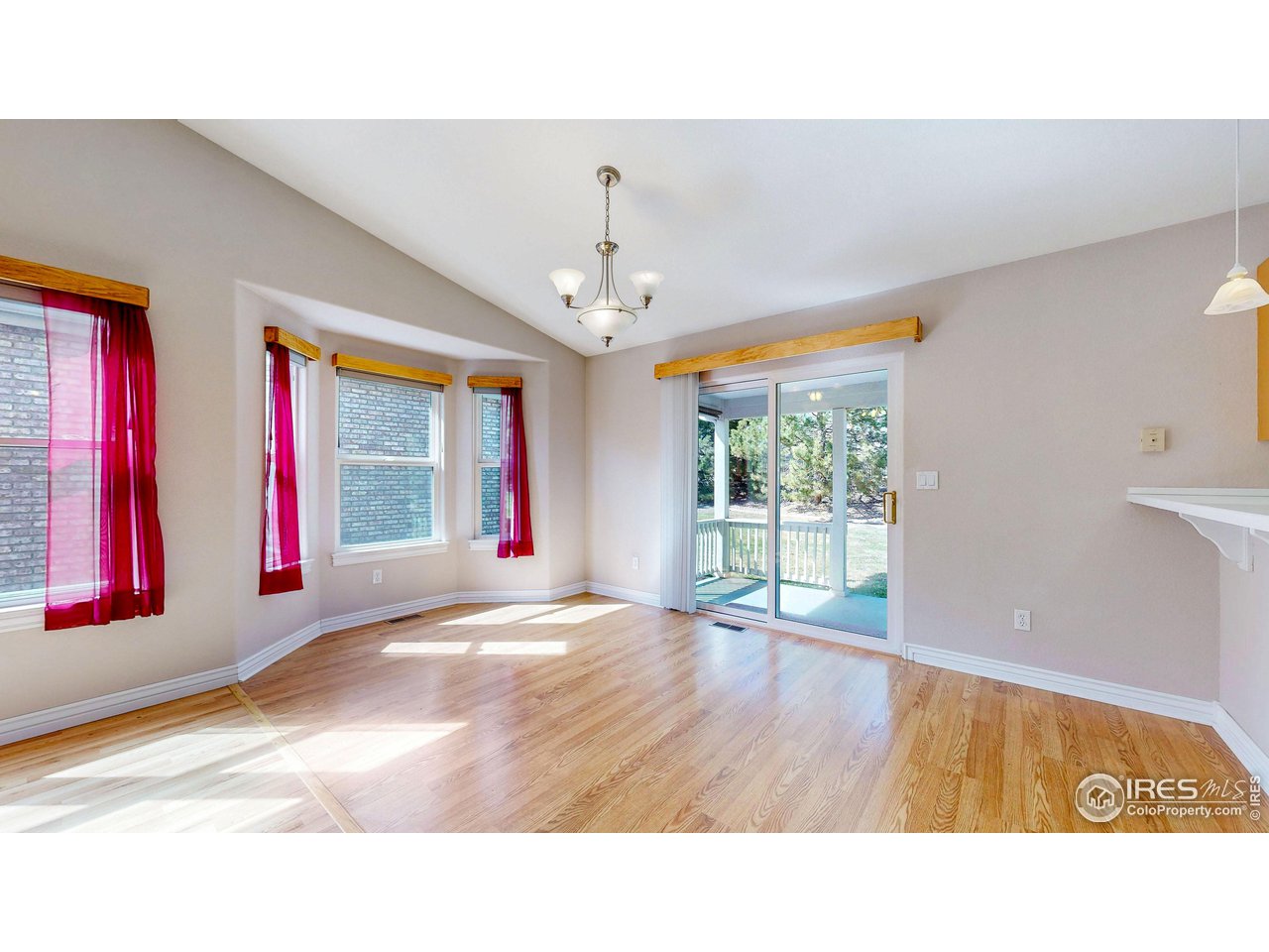 3585 West 20th Street Road Greeley, CO 80634 - Photo 9 of 32 a living room with furniture and a flat screen tv