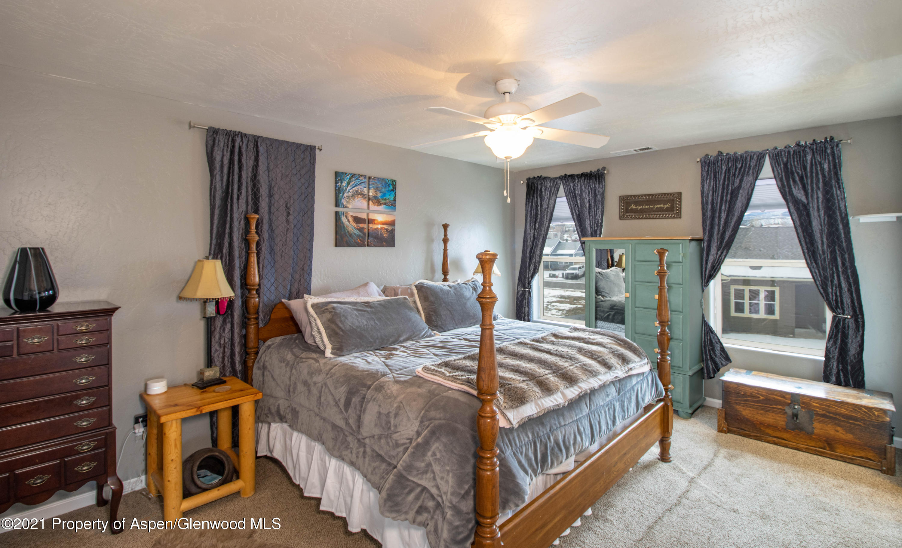 1259 East 18th Way Rifle, CO 81650 - Photo 13 of 17 a bed room with a bed and a couch