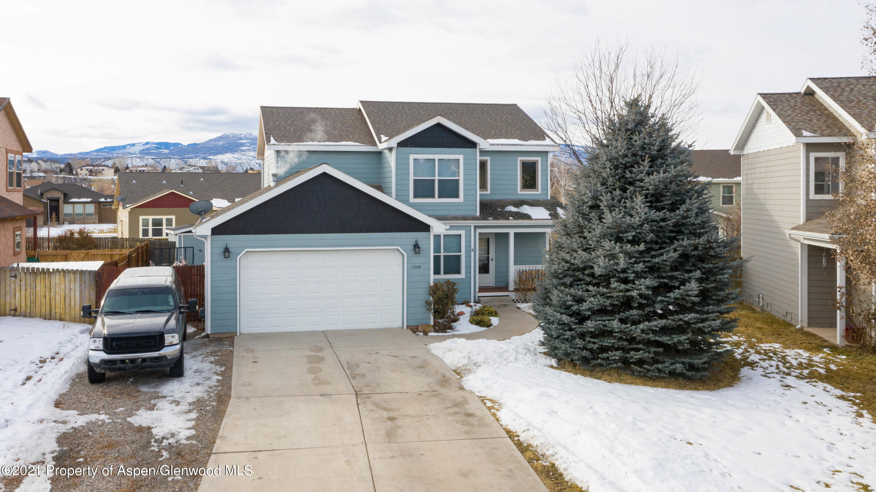 1259 East 18th Way Rifle, CO 81650 - Photo 5 of 17 a view of a house with a yard
