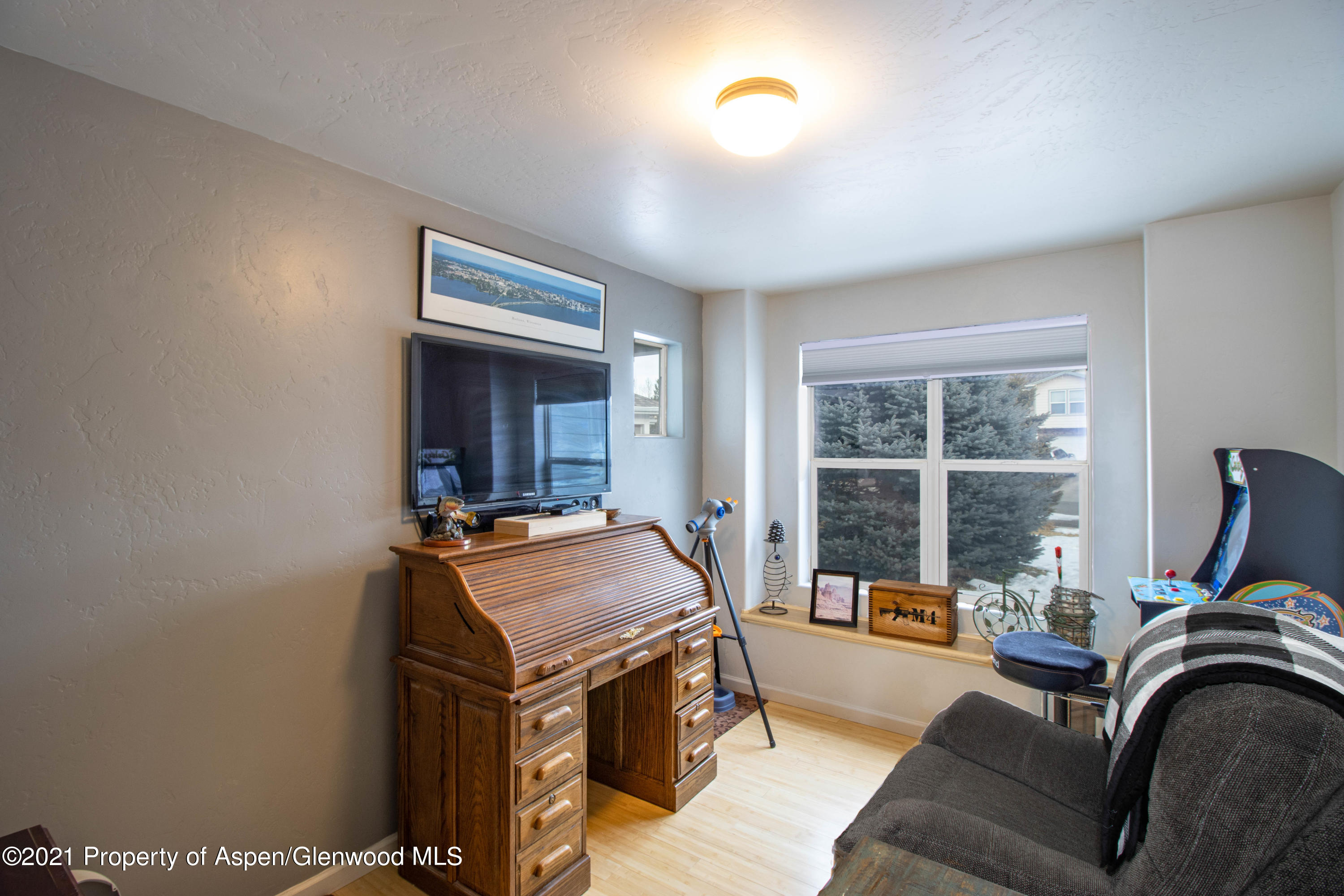 1259 East 18th Way Rifle, CO 81650 - Photo 10 of 17 a living room with furniture and a window
