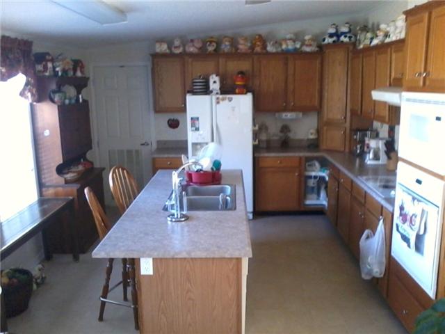 70 Ballenger Road Carthage, TN 37030 - Photo 3 of 11 Does someone in your family love to cook? Then this is the perfect kitchen! A separate pantry helps make this spacious kitchen a delight!