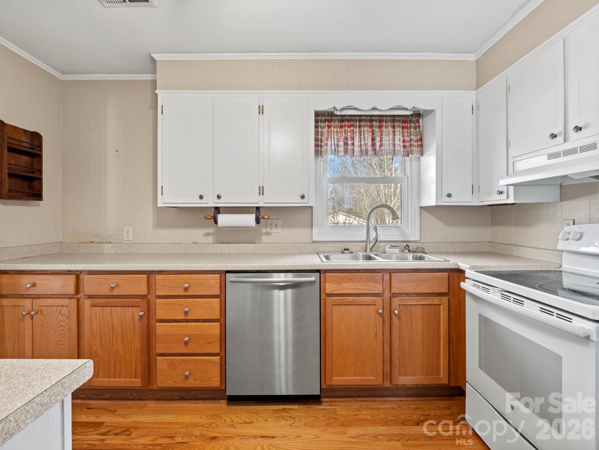 1429 Doggett Road Forest City, NC 28043 - Photo 13 of 33 a kitchen with stainless steel appliances granite countertop a sink stove and cabinets