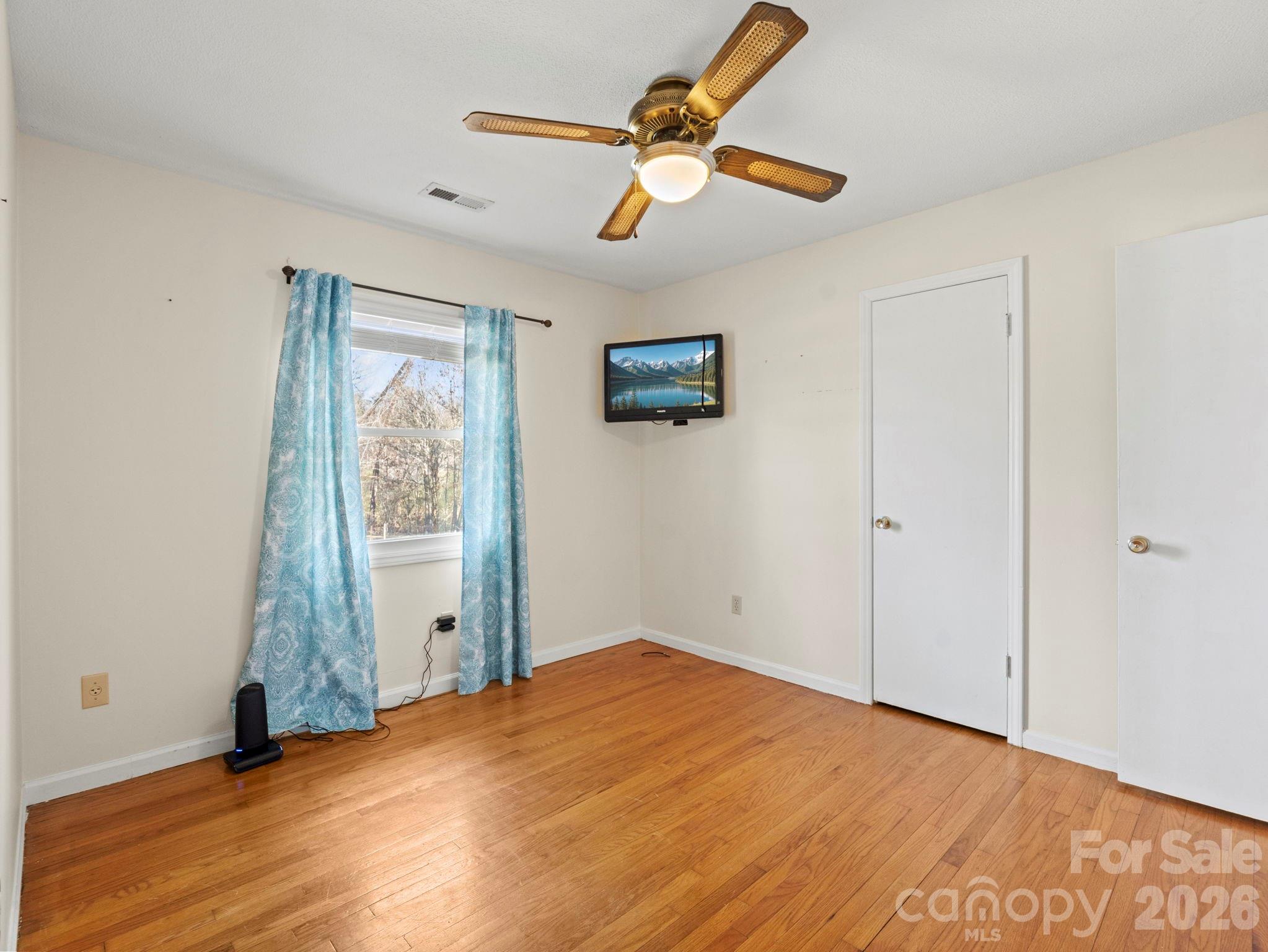 1429 Doggett Road Forest City, NC 28043 - Photo 23 of 33 an empty room with closet and a ceiling fan