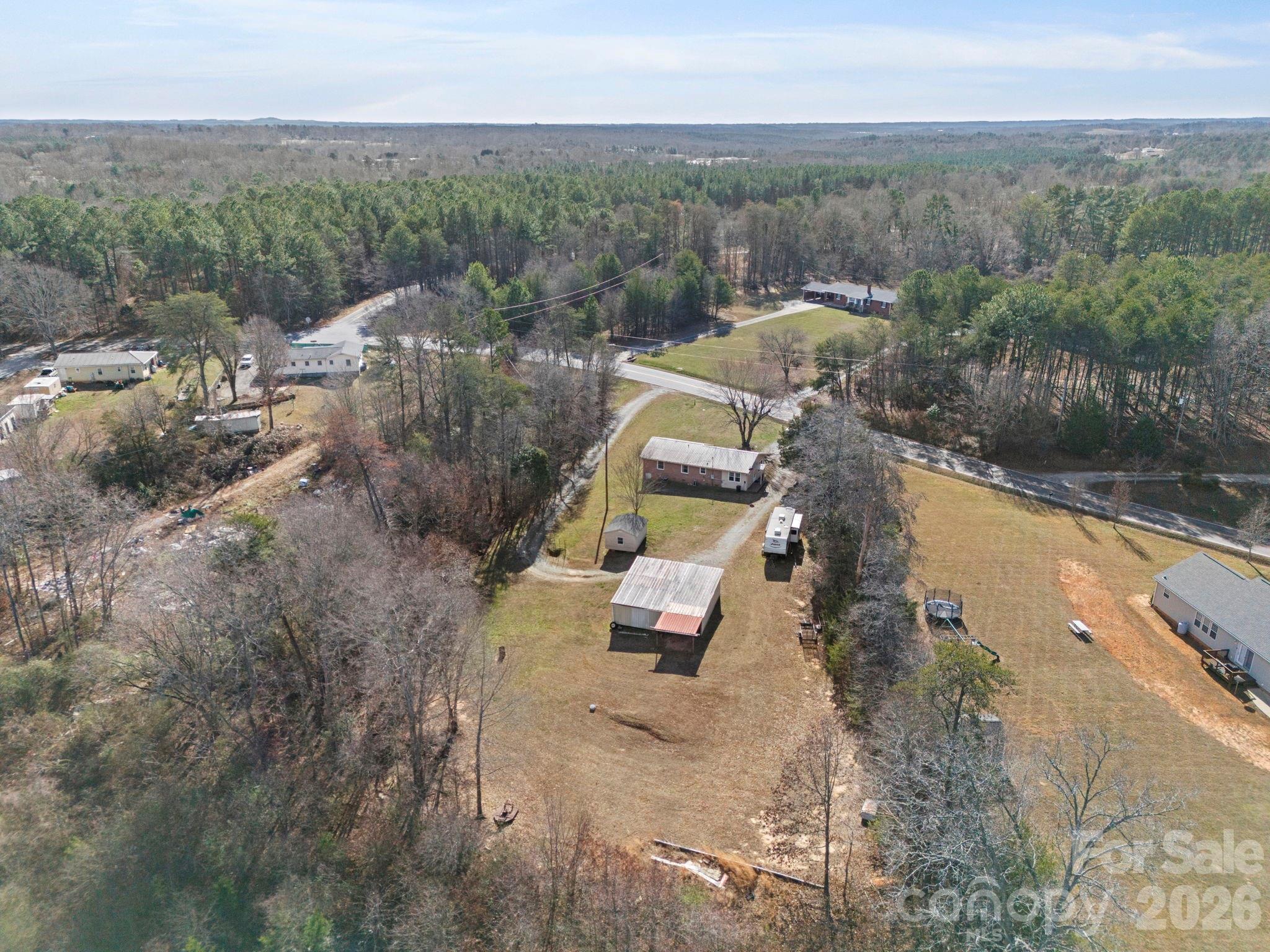 1429 Doggett Road Forest City, NC 28043 - Photo 30 of 33 an aerial view of a house with a yard