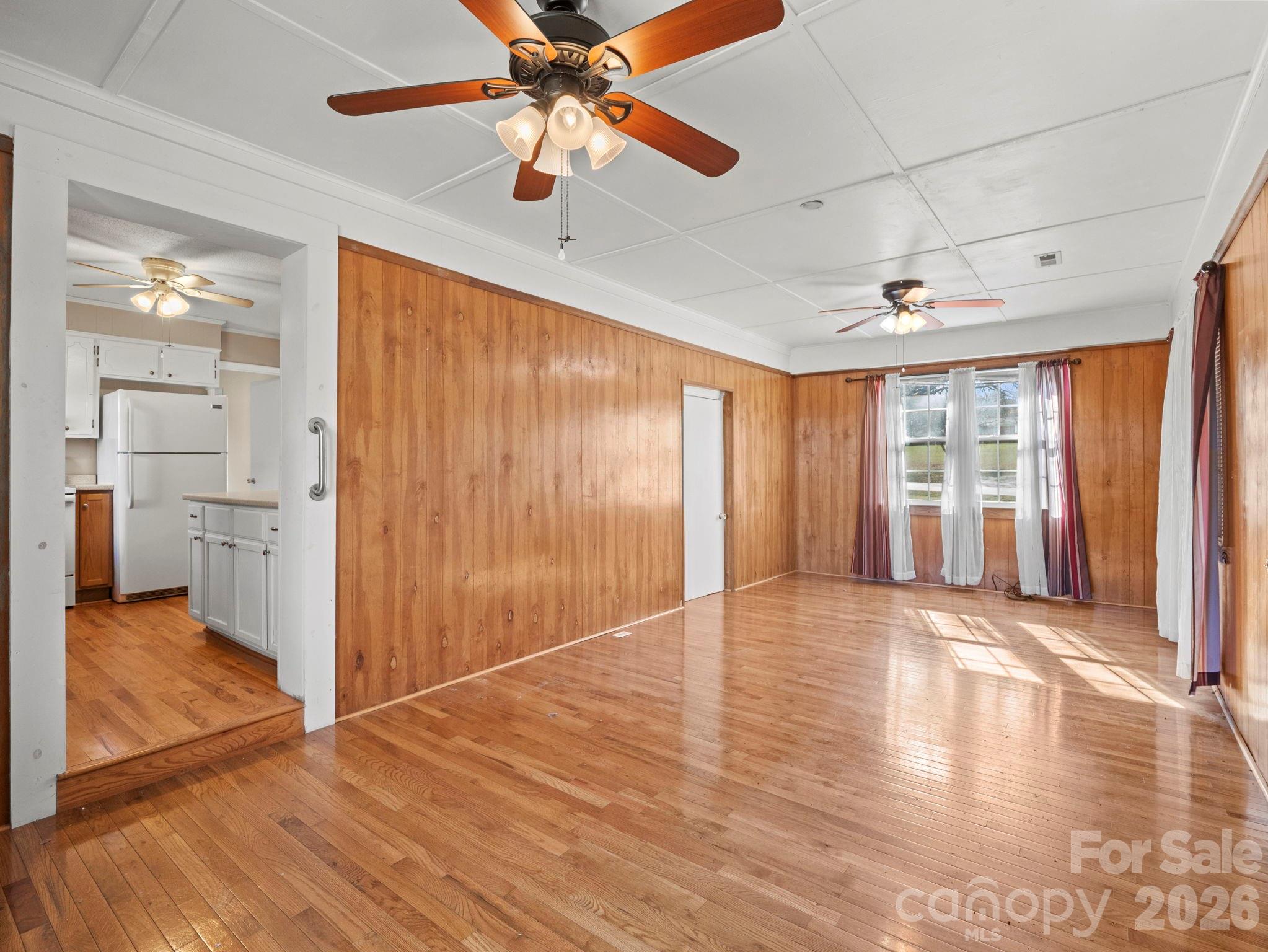 1429 Doggett Road Forest City, NC 28043 - Photo 9 of 33 a view of an empty room with window and wooden floor