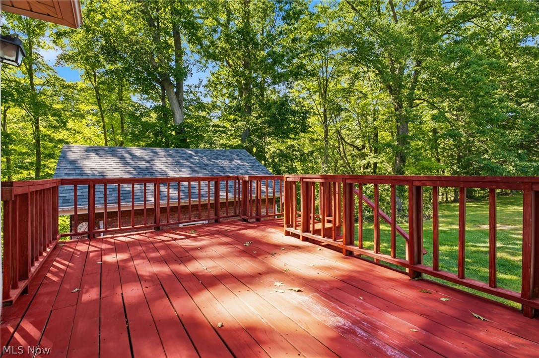 759 Runkle Avenue Ashtabula, OH 44004 - Photo 24 of 40 Expansive red-stained wood deck featuring a protective railing system