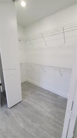 a view of a room with racks on the wall