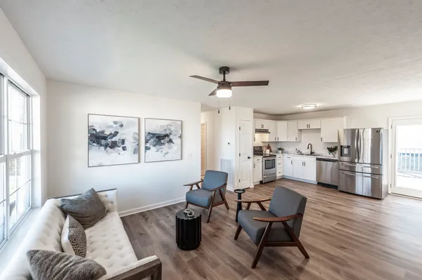 a kitchen with cabinets a sink and appliances