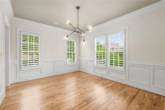 a living room with a fireplace and a wooden floor